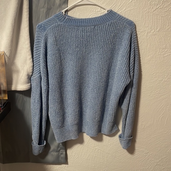 I am still selling a blue knitted sweater. It is very soft. It is a size medium. - Picture 2 of 3